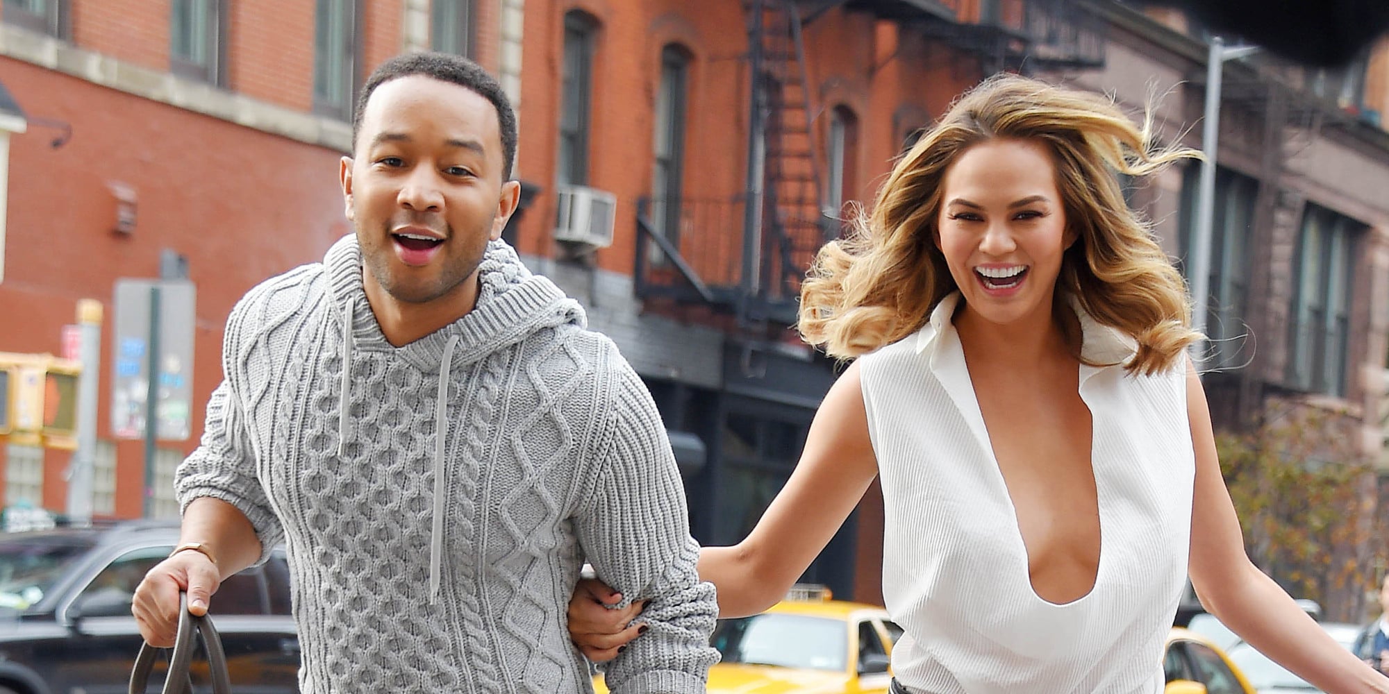 NEW YORK NY - DECEMBER 01: John Legend and wife Chrissy Teigen share sighting on December 1, 2014 in New York City. (Photo by Josiah Kamau/BuzzFoto/FilmMagic)