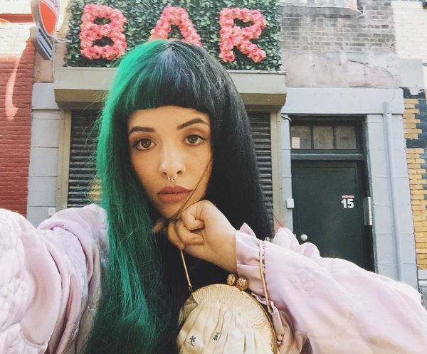 00 Holding Melanie Martinez1